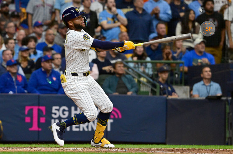 Oct 2, 2024; Milwaukee, Wisconsin, USA; Milwaukee Brewers outfielder Jackson Chourio (11) hits a home run during the eighth inning in game two of the Wildcard round for the 2024 MLB Playoffs against the New York Mets at American Family Field. Credit: Benny Sieu-Imagn Images