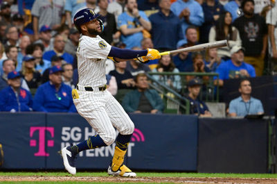 Oct 2, 2024; Milwaukee, Wisconsin, USA; Milwaukee Brewers outfielder Jackson Chourio (11) hits a home run during the eighth inning in game two of the Wildcard round for the 2024 MLB Playoffs against the New York Mets at American Family Field. Mandatory Credit: Benny Sieu-Imagn Images