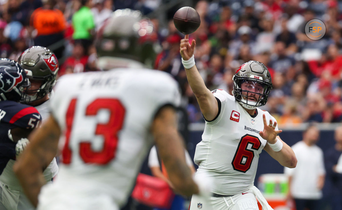 Nov 5, 2023; Houston, Texas, USA; Tampa Bay Buccaneers quarterback Baker Mayfield (6) passes to wide receiver Mike Evans (13) against the Houston Texans in the first quarter at NRG Stadium. Credit: Thomas Shea-USA TODAY Sports