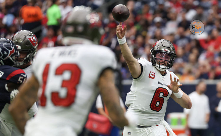 Nov 5, 2023; Houston, Texas, USA; Tampa Bay Buccaneers quarterback Baker Mayfield (6) passes to wide receiver Mike Evans (13) against the Houston Texans in the first quarter at NRG Stadium. Credit: Thomas Shea-USA TODAY Sports