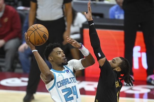 Dec 14, 2025; Cleveland, Ohio, USA; Charlotte Hornets forward Brandon Miller (24) shoots beside Cleveland Cavaliers guard Darius Garland (10) in the fourth quarter at Rocket Arena. Mandatory Credit: David Richard-Imagn Images