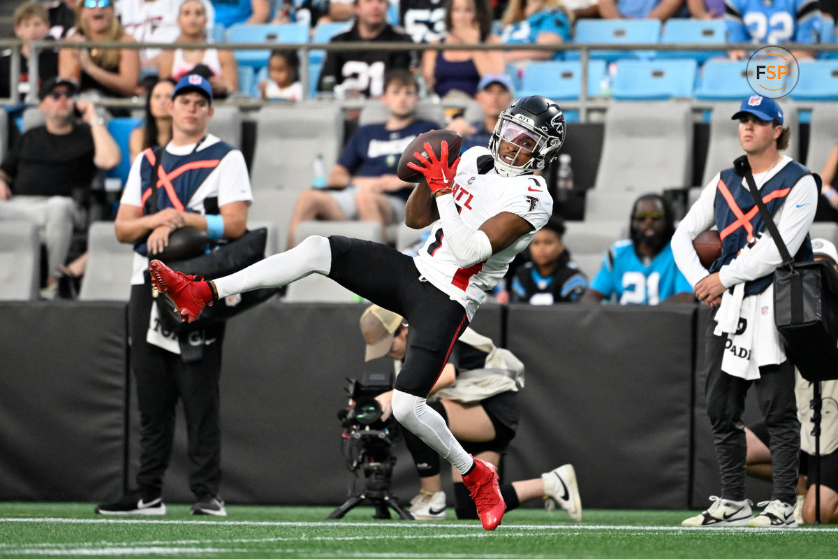 Oct 13, 2024; Charlotte, North Carolina, USA; Atlanta Falcons wide receiver Darnell Mooney (1) catches the ball in the second quarter at Bank of America Stadium. Credit: Bob Donnan-Imagn Images