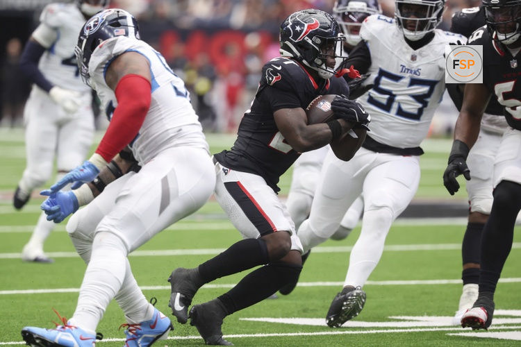Sep 28, 2025; Houston, Texas, USA; Houston Texans running back Woody Marks (27) runs with the ball during the fourth quarter against the Tennessee Titans at NRG Stadium. Credit: Troy Taormina-Imagn Images