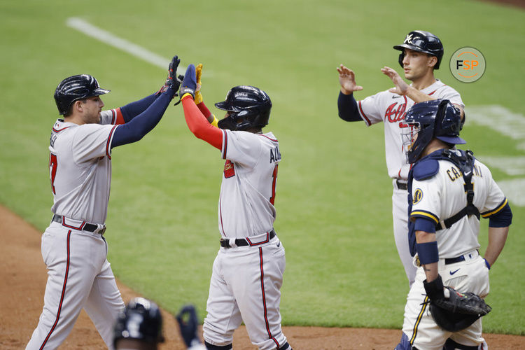 MILWAUKEE, WI - MAY 18: Atlanta Braves third baseman Austin Riley (27) celebrates with right fielder Ronald Acuna Jr. (13) and first baseman Matt Olson (28) after hitting a three-run home run in the third inning of an MLB game against the Milwaukee Brewers on May 18, 2022 at American Family Field in Milwaukee, Wisconsin. (Photo by Joe Robbins/Icon Sportswire)