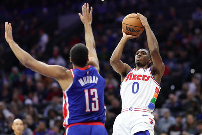 Jan 29, 2025; Philadelphia, Pennsylvania, USA; Philadelphia 76ers guard Tyrese Maxey (0) shoots in front of Sacramento Kings forward Keegan Murray (13) during the third quarter at Wells Fargo Center. Mandatory Credit: Bill Streicher-Imagn Images