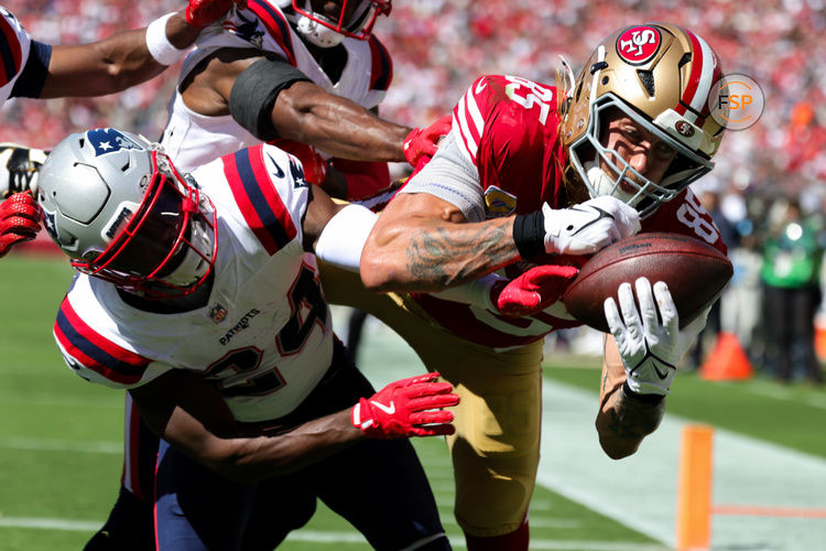 Sep 29, 2024; Santa Clara, California, USA; San Francisco 49ers tight end George Kittle (85) catches a touchdown against New England Patriots safety Dell Pettus (24) during the second quarter at Levi's Stadium. Credit: Sergio Estrada-Imagn Images