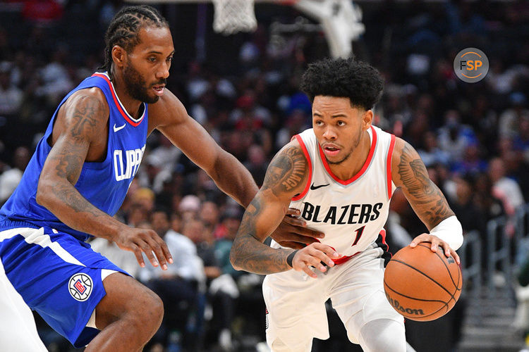 LOS ANGELES, CA - OCTOBER 25: Los Angeles Clippers forward Kawhi Leonard (2) closely guards Portland Trail Blazers guard Anfernee Simons (1) during a NBA  game between the Denver Nuggets and the Portland Trail Blazers on October 25, 2023 at Crypto.com Arena in Los Angeles, CA. (Photo by Brian Rothmuller/Icon Sportswire)