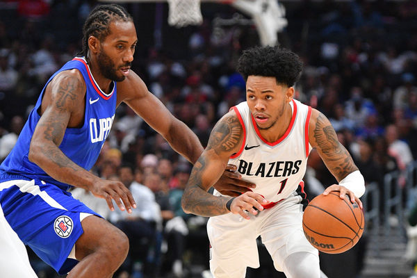 LOS ANGELES, CA - OCTOBER 25: Los Angeles Clippers forward Kawhi Leonard (2) closely guards Portland Trail Blazers guard Anfernee Simons (1) during a NBA  game between the Denver Nuggets and the Portland Trail Blazers on October 25, 2023 at Crypto.com Arena in Los Angeles, CA. (Photo by Brian Rothmuller/Icon Sportswire)