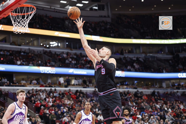 Jan 14, 2026; Chicago, Illinois, USA; Chicago Bulls center Nikola Vucevic (9) shoots against the Utah Jazz during the second half at United Center. Credit: Kamil Krzaczynski-Imagn Images