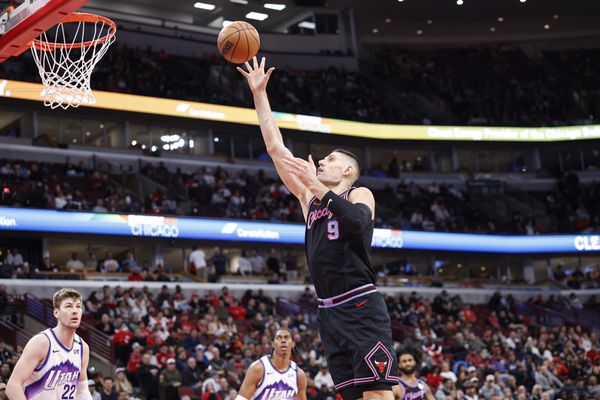 Jan 14, 2026; Chicago, Illinois, USA; Chicago Bulls center Nikola Vucevic (9) shoots against the Utah Jazz during the second half at United Center. Mandatory Credit: Kamil Krzaczynski-Imagn Images