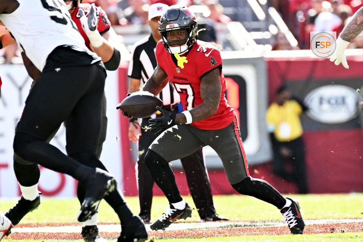 Jan 5, 2025; Tampa, Florida, USA; Tampa Bay Buccaneers running back Bucky Irving (7) runs the ball in the first quarter against the New Orleans Saints at Raymond James Stadium. Credit: Jonathan Dyer-Imagn Images