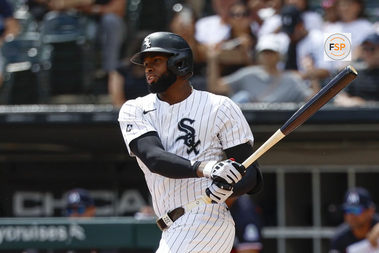 Aug 24, 2025; Chicago, Illinois, USA; Chicago White Sox center fielder Luis Robert Jr. (88) singles against the Minnesota Twins during the first inning at Rate Field. Credit: Kamil Krzaczynski-Imagn Images