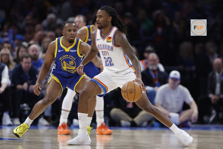 Mar 7, 2026; Oklahoma City, Oklahoma, USA; Oklahoma City Thunder guard Cason Wallace (22) drives past Golden State Warriors guard Lj Cryer (18) during the second half at Paycom Center. Credit: Alonzo Adams-Imagn Images