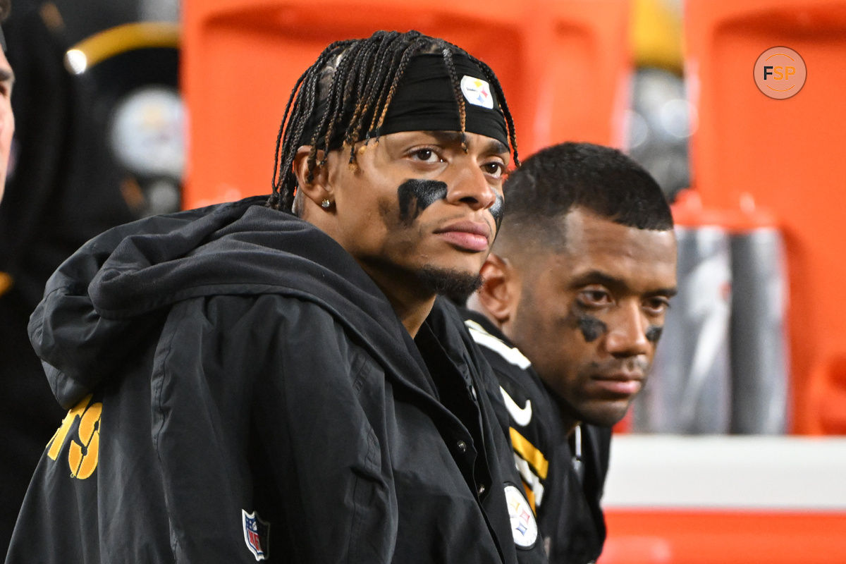 Oct 20, 2024; Pittsburgh, Pennsylvania, USA; Pittsburgh Steelers quarterbacks Justin Fields (2) and Russell Wilson (3) watch the action against the New York Jets during the fourth quarter at Acrisure Stadium. Credit: Barry Reeger-Imagn Images