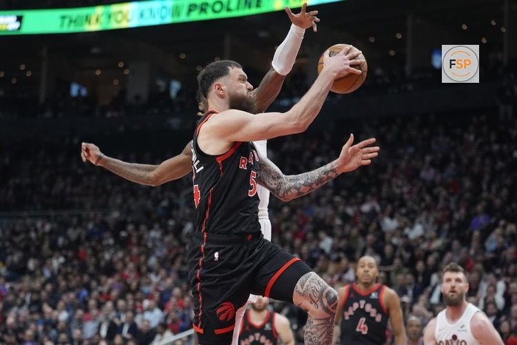 Apr 23, 2026; Toronto, Ontario, CAN; Toronto Raptors forward Sandro Mamukelashvili (54) goes to pass the ball against the Cleveland Cavaliers during the first half of game three of the first round of the 2026 NBA Playoffs at Scotiabank Arena. Credit: John E. Sokolowski-Imagn Images