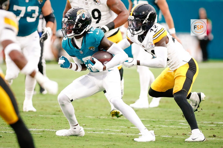 Aug 9, 2025; Jacksonville, Florida, USA; Jacksonville Jaguars wide receiver Travis Hunter (12) runs after a catch against the Pittsburgh Steelers during a preseason game at EverBank Stadium. Credit: Travis Register-Imagn Images