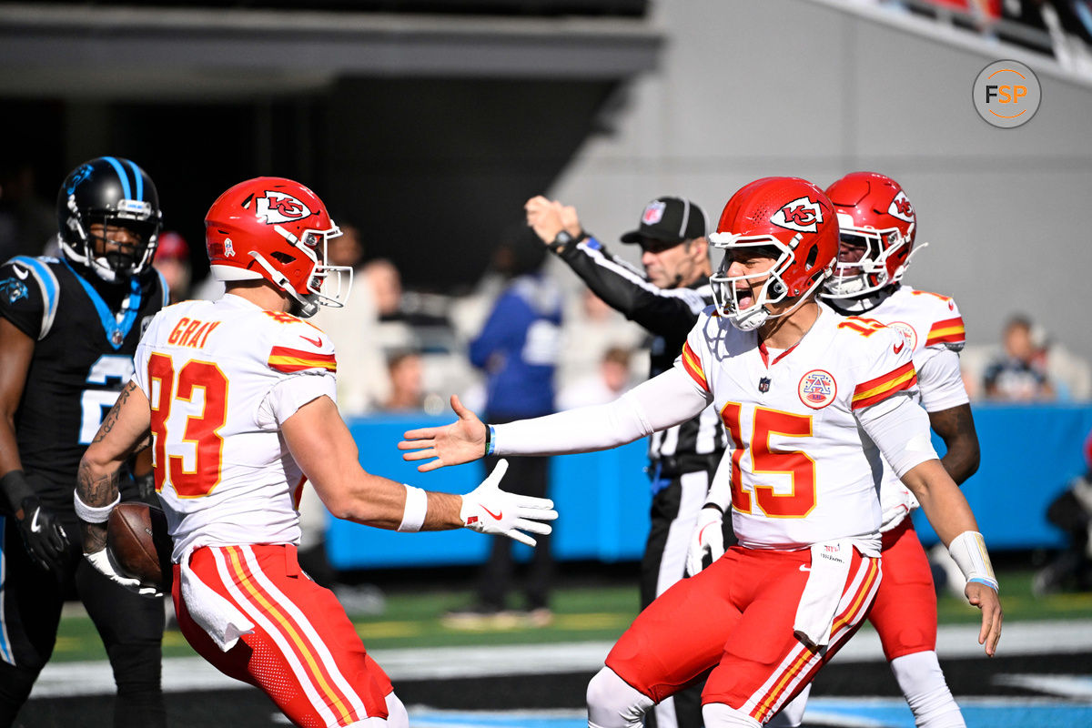 Nov 24, 2024; Charlotte, North Carolina, USA; Kansas City Chiefs tight end Noah Gray (83) celebrates with quarterback Patrick Mahomes (15) after scoring a touchdown in the first quarter at Bank of America Stadium. Credit: Bob Donnan-Imagn Images