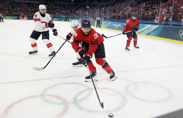 Feb 13, 2026; Milan, Italy; Brandon Hagel of Canada in action with Kevin Fiala of Switzerland  in men's ice hockey group A play during the Milano Cortina 2026 Olympic Winter Games at Milano Santagiulia Ice Hockey Arena. Mandatory Credit: Geoff Burke-Imagn Images