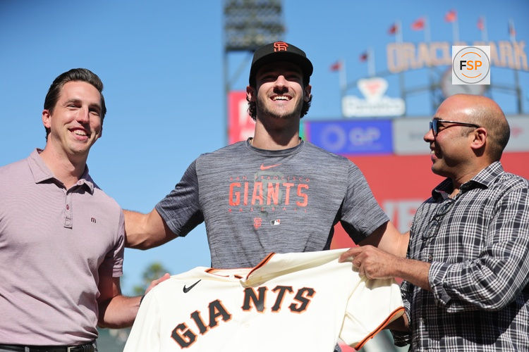 Jul 26, 2023; San Francisco, California, USA; San Francisco Giants general manager Pete Putila, first round draft pick Bryce Eldridge, and president of baseball operations Farhan Zaidi pose for a photo before the game against the Oakland Athletics at Oracle Park. Credit: Sergio Estrada-USA TODAY Sports