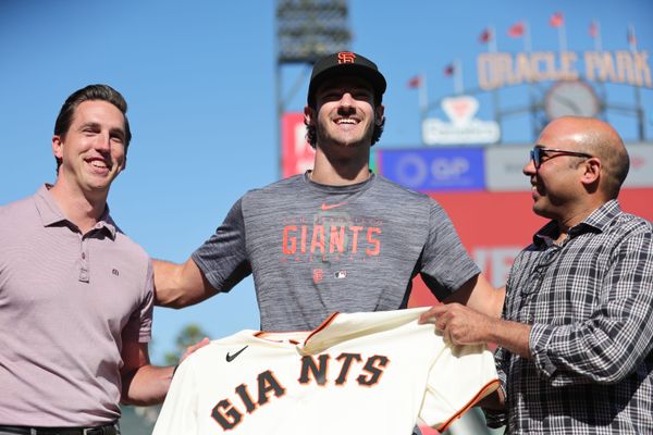 Jul 26, 2023; San Francisco, California, USA; San Francisco Giants general manager Pete Putila, first round draft pick Bryce Eldridge, and president of baseball operations Farhan Zaidi pose for a photo before the game against the Oakland Athletics at Oracle Park. Mandatory Credit: Sergio Estrada-USA TODAY Sports
