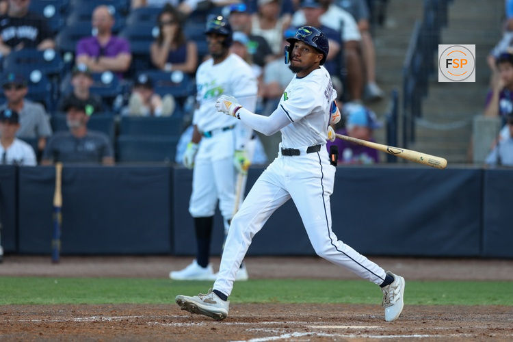 Apr 19, 2025; Tampa, Florida, USA; Tampa Bay Rays center fielder Chandler Simpson (14) doubles against the New York Yankees in the ninth inning at George M. Steinbrenner Field. Credit: Nathan Ray Seebeck-Imagn Images