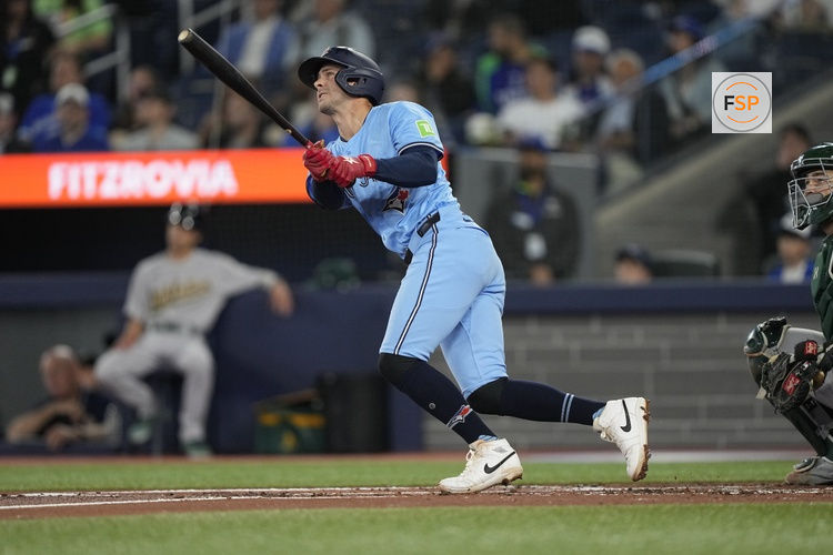 May 29, 2025; Toronto, Ontario, CAN; Toronto Blue Jays third baseman Ernie Clement (22) hits a three run home run against the Athletics during the second inning at Rogers Centre. Credit: John E. Sokolowski-Imagn Images