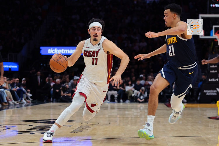 Dec 29, 2025; Miami, Florida, USA; Miami Heat forward Jaime Jaquez Jr. (11) drives to the basket against Denver Nuggets forward Spencer Jones (21) during the fourth quarter at Kaseya Center. Credit: Sam Navarro-Imagn Images