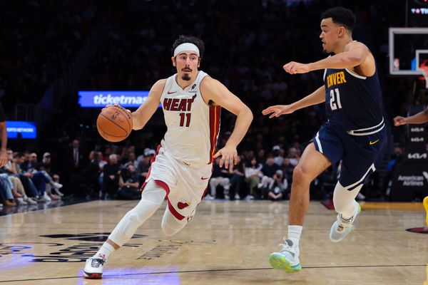 Dec 29, 2025; Miami, Florida, USA; Miami Heat forward Jaime Jaquez Jr. (11) drives to the basket against Denver Nuggets forward Spencer Jones (21) during the fourth quarter at Kaseya Center. Mandatory Credit: Sam Navarro-Imagn Images