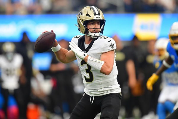 Oct 27, 2024; Inglewood, California, USA; New Orleans Saints quarterback Jake Haener (3) throws against the Los Angeles Chargers during the second half at SoFi Stadium. Mandatory Credit: Gary A. Vasquez-Imagn Images