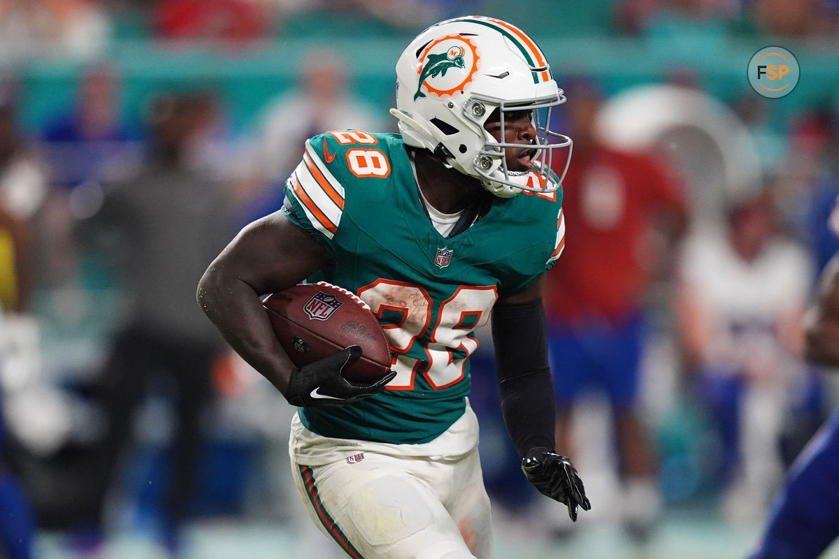 Sep 12, 2024; Miami Gardens, Florida, USA; Miami Dolphins running back De'Von Achane (28) rushes with the ball against the Buffalo Bills during the second half at Hard Rock Stadium. Credit: Jasen Vinlove-Imagn Images