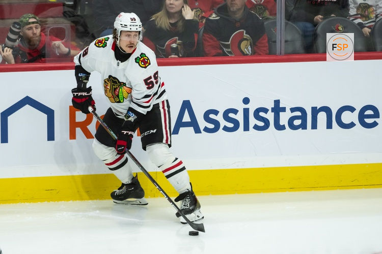 Apr 15, 2025; Ottawa, Ontario, CAN; Chicago Blackhawks left wing Tyler Bertuzzi (59) controls the puck in the third period against the Ottawa Senators at the Canadian Tire Centre. Credit: Marc DesRosiers-Imagn Images