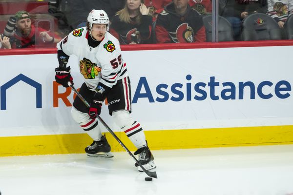 Apr 15, 2025; Ottawa, Ontario, CAN; Chicago Blackhawks left wing Tyler Bertuzzi (59) controls the puck in the third period against the Ottawa Senators at the Canadian Tire Centre. Mandatory Credit: Marc DesRosiers-Imagn Images