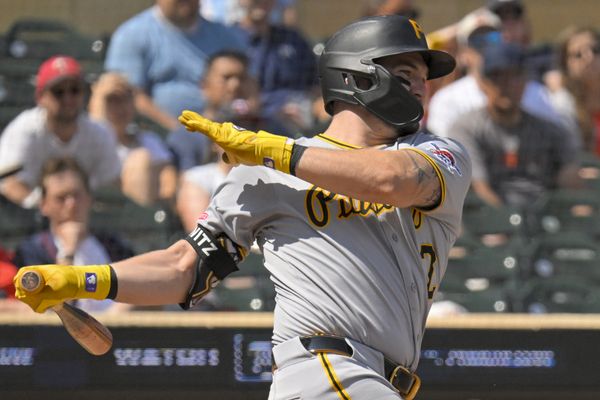 Jul 13, 2025; Minneapolis, Minnesota, USA; Pittsburgh Pirates infielder Spencer Horwitz (2) drives in the winning run against the Minnesota Twins on a fielder’s choice during the ninth inning at Target Field. Mandatory Credit: Nick Wosika-Imagn Images