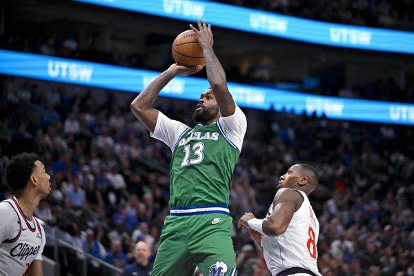 Mar 21, 2026; Dallas, Texas, USA; Dallas Mavericks forward Naji Marshall (13) makes a jump shot during the game between the Mavericks and the Clippers at American Airlines Center. Mandatory Credit: Jerome Miron-Imagn Images