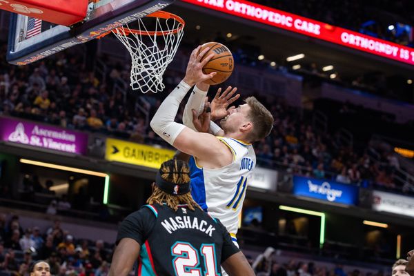 Mar 1, 2026; Indianapolis, Indiana, USA; Indiana Pacers center Micah Potter (11) shoots the ball while  Memphis Grizzlies guard Jahmai Mashack (21) defends in the first half at Gainbridge Fieldhouse. Mandatory Credit: Trevor Ruszkowski-Imagn Images