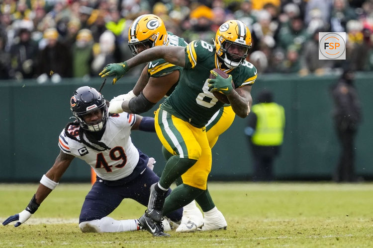 Jan 5, 2025; Green Bay, Wisconsin, USA;  Green Bay Packers running back Josh Jacobs (8) during the game against the Chicago Bears at Lambeau Field. Credit: Jeff Hanisch-Imagn Images