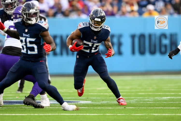 Nov 17, 2024; Nashville, Tennessee, USA;  Tennessee Titans running back Tony Pollard (20) runs the ball against the Minnesota Viking during the second half during the first half at Nissan Stadium. Credit: Steve Roberts-Imagn Images