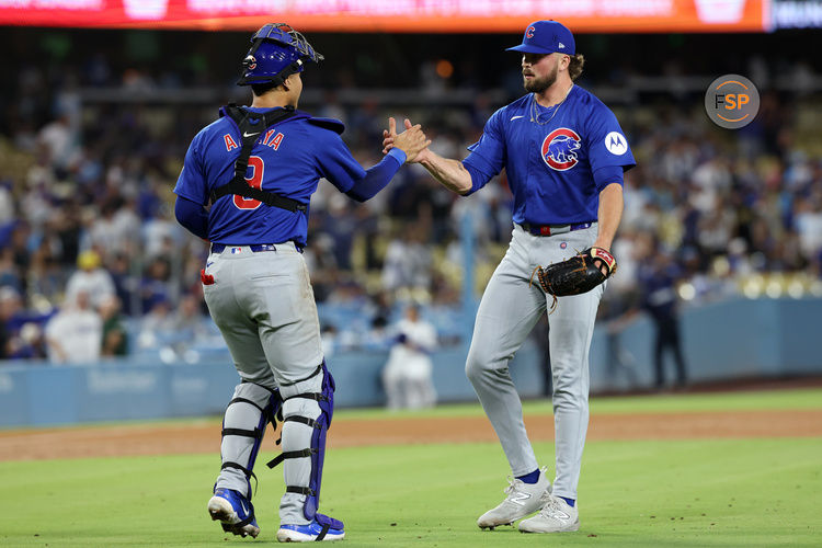 Sep 10, 2024; Los Angeles, California, USA;  Chicago Cubs relief pitcher Porter Hodge (37) and catcher Miguel Amaya (9) celebrate a victory after defeating the Los Angeles Dodgers at Dodger Stadium. Credit: Kiyoshi Mio-Imagn Images