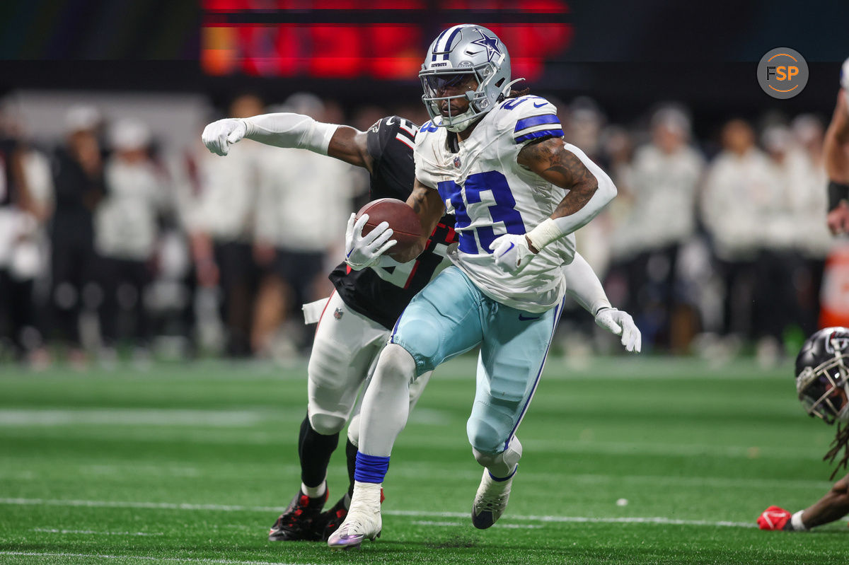 Nov 3, 2024; Atlanta, Georgia, USA; Dallas Cowboys running back Rico Dowdle (23) runs the ball against the Atlanta Falcons in the fourth quarter at Mercedes-Benz Stadium. Credit: Brett Davis-Imagn Images