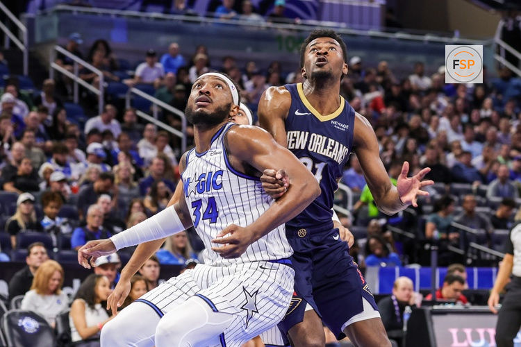 Oct 16, 2025; Orlando, Florida, USA; Orlando Magic center Wendell Carter Jr. (34) and New Orleans Pelicans center Yves Missi (21) look for the rebound during the second half at Kia Center. Credit: Mike Watters-Imagn Images