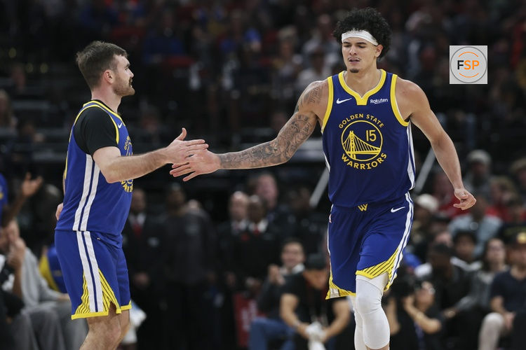 Mar 5, 2026; Houston, Texas, USA; Golden State Warriors forward Gui Santos (15) celebrates with guard Pat Spencer (61) after scoring a basket during the third quarter against the Houston Rockets at Toyota Center. Credit: Troy Taormina-Imagn Images