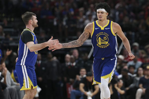 Mar 5, 2026; Houston, Texas, USA; Golden State Warriors forward Gui Santos (15) celebrates with guard Pat Spencer (61) after scoring a basket during the third quarter against the Houston Rockets at Toyota Center. Mandatory Credit: Troy Taormina-Imagn Images