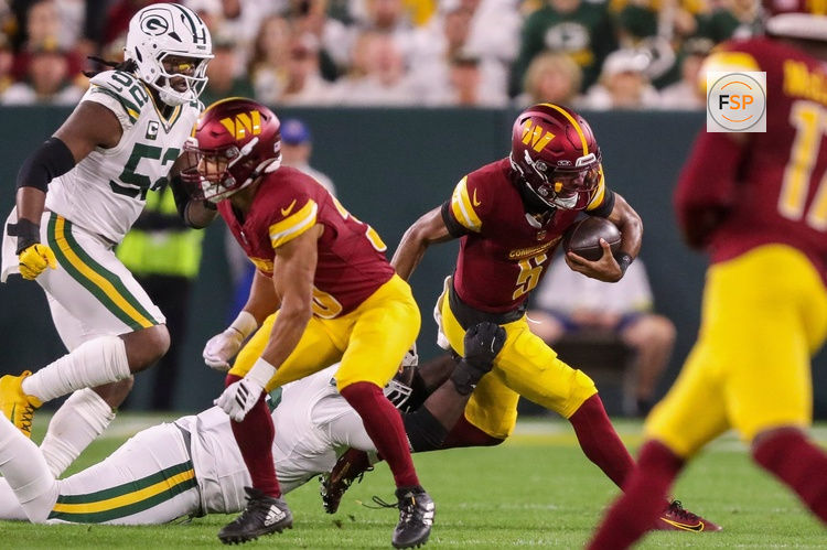 Washington Commanders quarterback Jayden Daniels (5) is sacked by Green Bay Packers defensive tackle Devonte Wyatt (95) on Thursday, September 11, 2025, at Lambeau Field in Green Bay, Wis. The Packers won the game, 27-18.
Tork Mason/USA TODAY NETWORK-Wisconsin