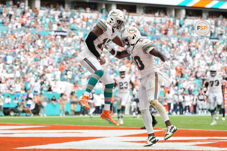 Oct 29, 2023; Miami Gardens, Florida, USA; Miami Dolphins wide receiver Jaylen Waddle (17) celebrates his touchdown against the New England Patriots with wide receiver Tyreek Hill (10) during the second half at Hard Rock Stadium. Credit: Jasen Vinlove-USA TODAY Sports