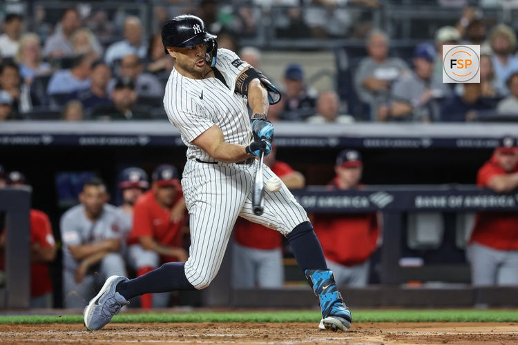 Aug 26, 2025; Bronx, New York, USA;  New York Yankees right fielder Giancarlo Stanton (27) hits a three run double in the third inning against the Washington Nationals at Yankee Stadium. Credit: Wendell Cruz-Imagn Images