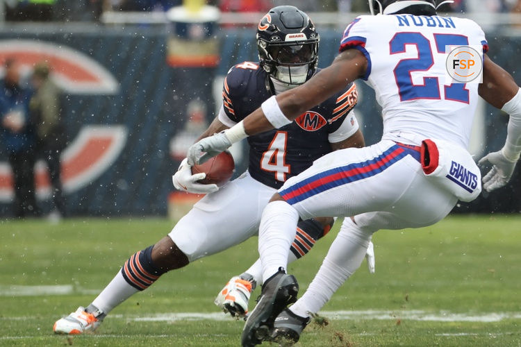 Nov 9, 2025; Chicago, Illinois, USA; Chicago Bears running back D'Andre Swift (4) rushes the ball against the New York Giants during the first half at Soldier Field. Credit: Mike Dinovo-Imagn Images