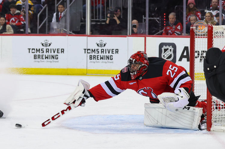 Jan 22, 2025; Newark, New Jersey, USA; New Jersey Devils goaltender Jacob Markstrom (25) makes a save against the Boston Bruins during the first period at Prudential Center. Credit: Ed Mulholland-Imagn Images