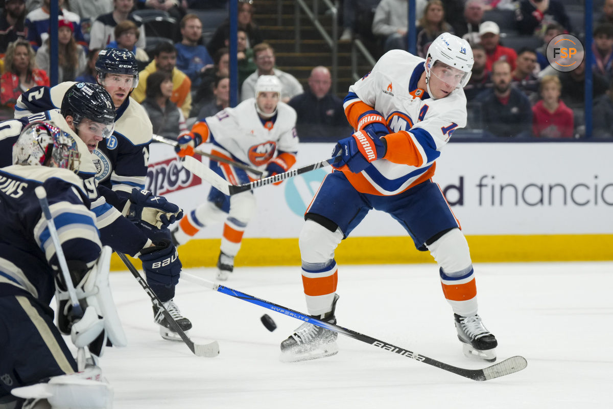 Oct 30, 2024; Columbus, Ohio, USA; New York Islanders center Bo Horvat (14) shoots the puck against the Columbus Blue Jackets in the first period at Nationwide Arena. Credit: Aaron Doster-Imagn Images