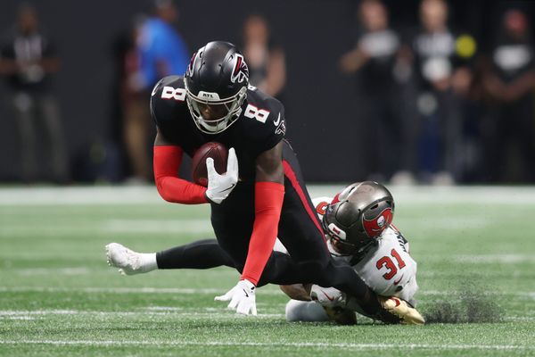Sep 7, 2025; Atlanta, Georgia, USA; Tampa Bay Buccaneers safety Antoine Winfield Jr. (31) tackles Atlanta Falcons tight end Kyle Pitts Sr. (8) during the third quarter at Mercedes-Benz Stadium. Mandatory Credit: Brett Davis-Imagn Images
