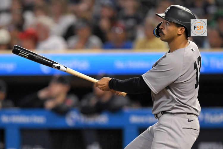 Sep 17, 2025; Minneapolis, Minnesota, USA;  New York Yankees outfielder Trent Grisham (12) flies out against the Minnesota Twins during the sixth inning at Target Field. Credit: Nick Wosika-Imagn Images

